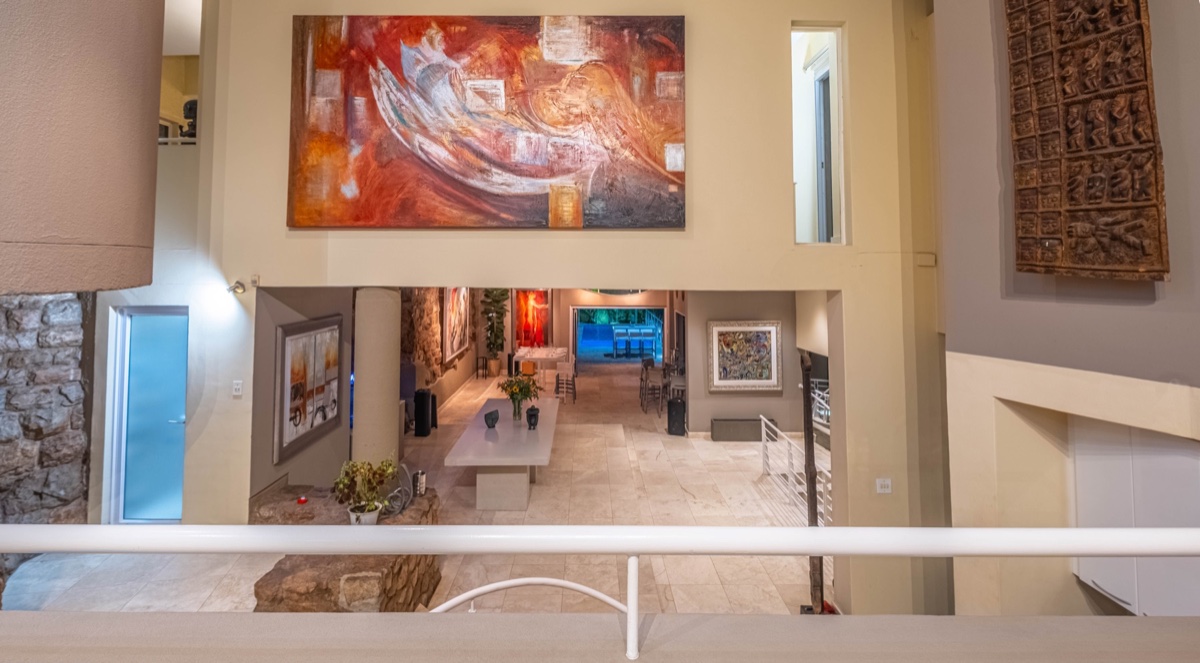 Elevated view through Cliffside's connected artwork hall and main event floor