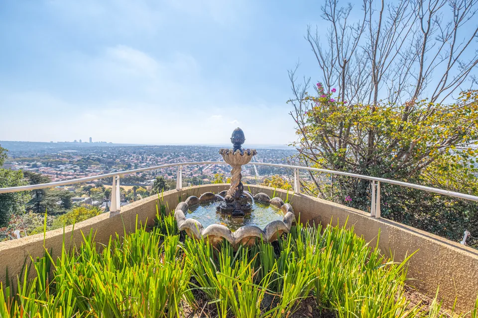 Ornamental fountain overlooking Johannesburg from the upper garden terrace
